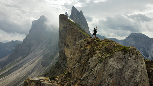 Man posing on top of Seceda ridgeline in the Dolomites